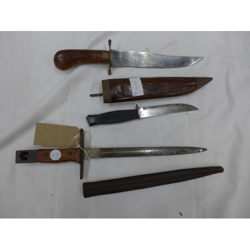 431 - A BAYONET AND SCABBARD, 23CM BLADE, TWO FURTHER KNIVES (3)