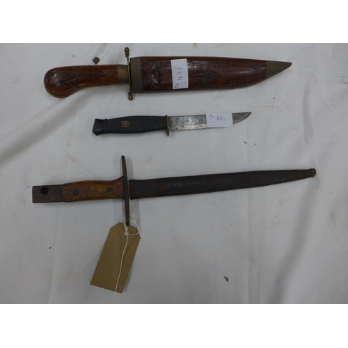 431 - A BAYONET AND SCABBARD, 23CM BLADE, TWO FURTHER KNIVES (3)