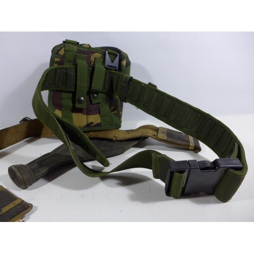 353 - A MILITARY ISSUE CANVAS BELT AND HOLSTER AND A CAMOUFLAGE BELT PACK (2)