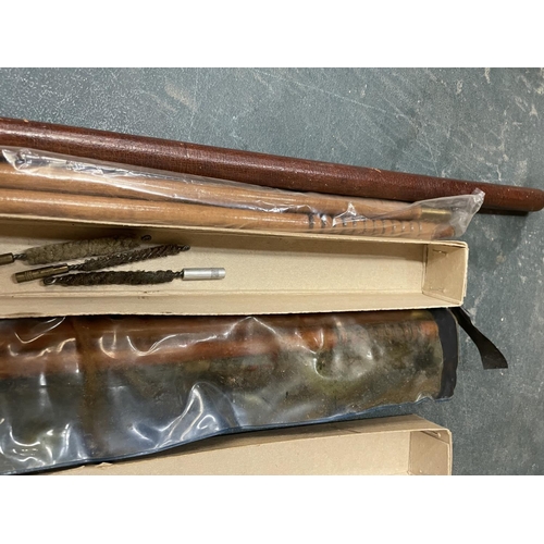 455 - A LEATHER SWAGGER STICK, TWO GUN CLEANING KITS AND A WHIP