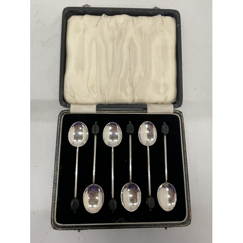 11 - A CASED SET OF SIX HALLMARKED SILVER COFFEE BEAN SPOONS