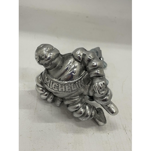 15 - A MICHELIN MAN WITH RACK / BADGE BAR CLAMP