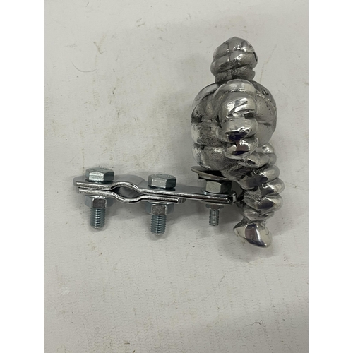 15 - A MICHELIN MAN WITH RACK / BADGE BAR CLAMP