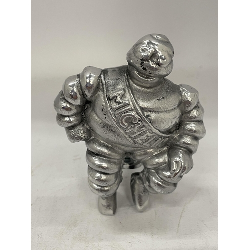 15 - A MICHELIN MAN WITH RACK / BADGE BAR CLAMP