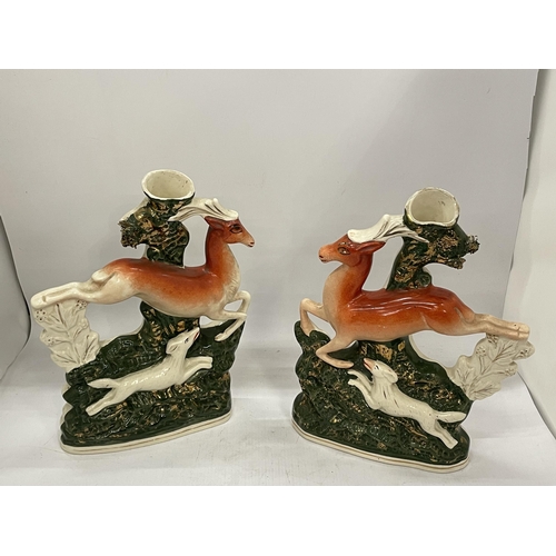 16 - A PAIR OF STAFFORDSHIRE FLATBACK DEER SPILL HOLDERS