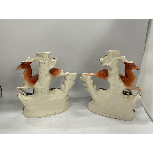 16 - A PAIR OF STAFFORDSHIRE FLATBACK DEER SPILL HOLDERS