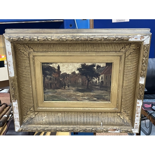 17 - AN ANTIQUE GILT FRAMED OIL PAINTING OF A VILLAGE SCENE, UNSIGNED