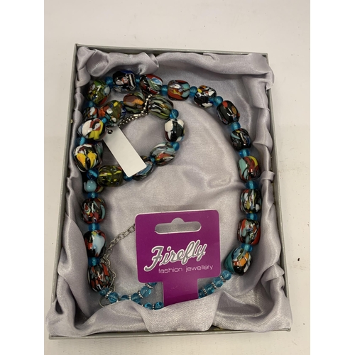 177 - A BOXED GLASS NECKLACE AND BRACELET SET