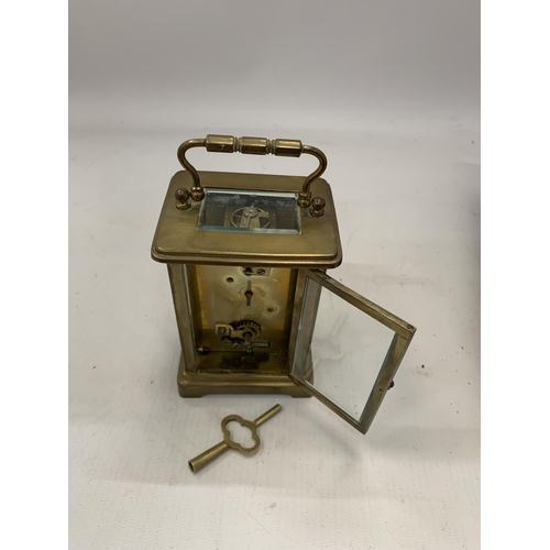 178 - A FRENCH BRASS CASED CARRIAGE CLOCK IN ORIGINAL OUTER CASE WITH KEY