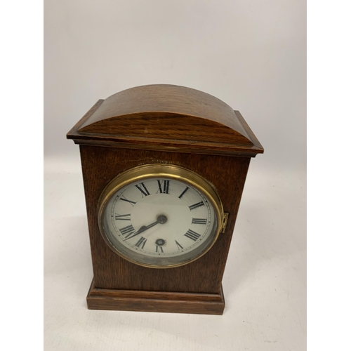 212 - A VINTAGE GERMAN OAK MANTLE CLOCK