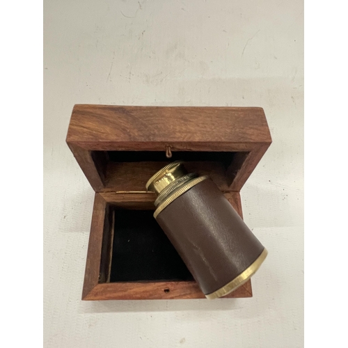 232 - A BOXED BRASS AND LEATHER TELESCOPE