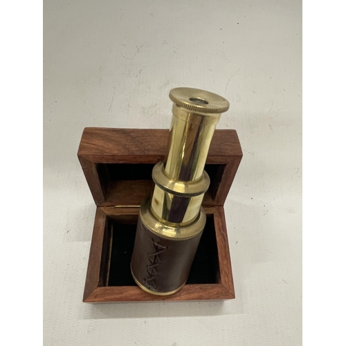 232 - A BOXED BRASS AND LEATHER TELESCOPE