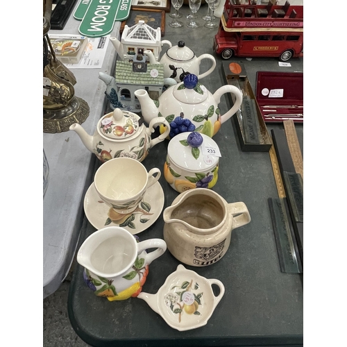 233 - A MIXED LOT OF CERAMIC TEAPOTS TO INCLUDE FRUIT DESIGN EXAMPLES