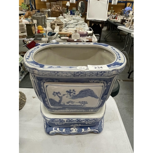 234 - A MODERN CHINESE BLUE AND WHITE PLANTER ON STAND