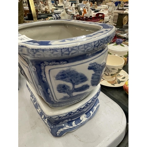 234 - A MODERN CHINESE BLUE AND WHITE PLANTER ON STAND