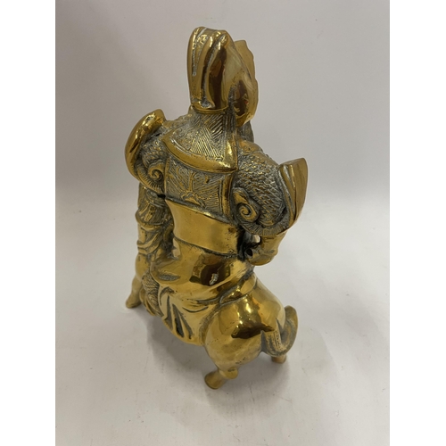 242 - AN ORIENTAL BRASS FIGURE OF A WARRIOR ON HORSEBACK