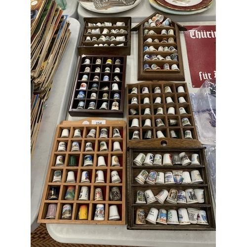 254 - SIX WOODEN DISPLAYS OF CERAMIC THIMBLES