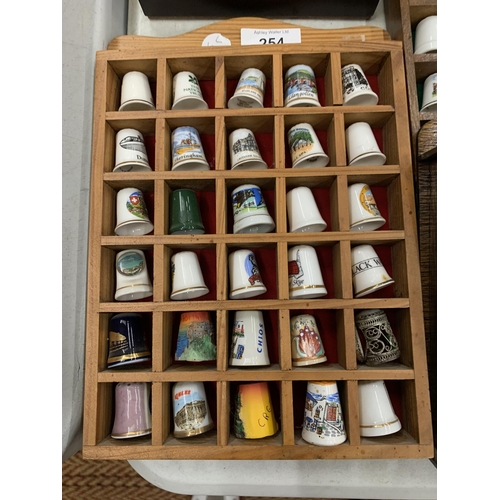 254 - SIX WOODEN DISPLAYS OF CERAMIC THIMBLES