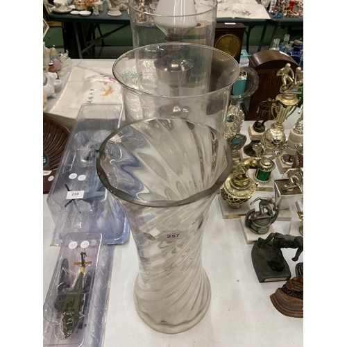 257 - THREE LARGE CLEAR GLASS VASES TO INCLUDE TWIST DESIGN EXAMPLE