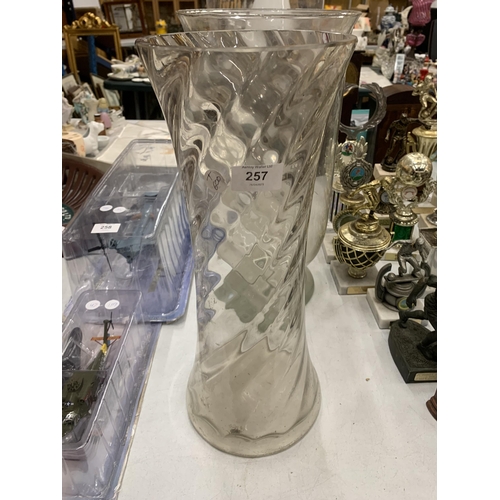 257 - THREE LARGE CLEAR GLASS VASES TO INCLUDE TWIST DESIGN EXAMPLE