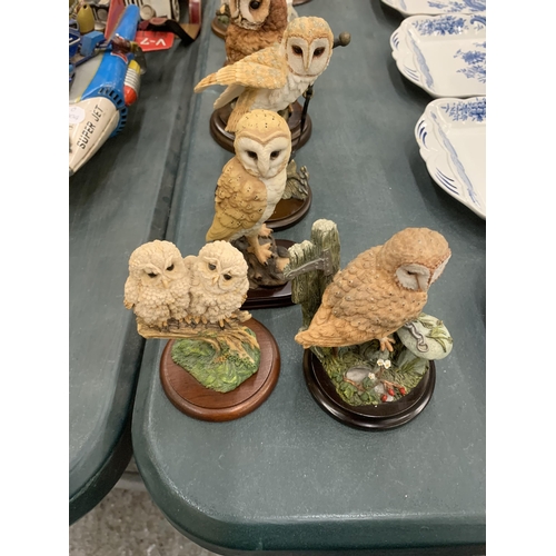 279 - A COLLECTION OF OWL ANIMAL FIGURES ON WOODEN BASES