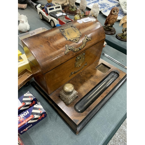 282 - A VINTAGE WALNUT DESK STAND WITH BRASS FITTINGS