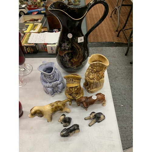 284 - A MIXED GROUP OF CERAMICS TO INCLUDE DOGS, TOBY JUGS AND A LARGE BIRD & FLORAL DESIGN JUG