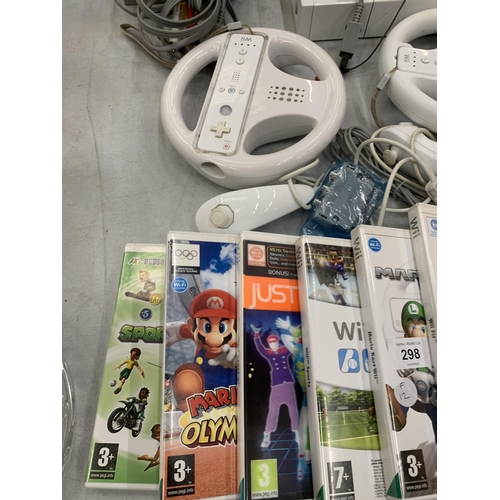 298 - A NINTENDO WII WITH GAMES, CONTROLLERS, WHEELS, MARIO GAMES ETC