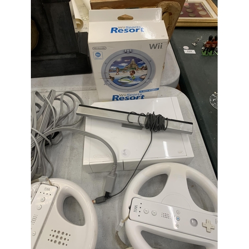 298 - A NINTENDO WII WITH GAMES, CONTROLLERS, WHEELS, MARIO GAMES ETC