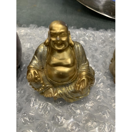 112 - A COLLECTION OF THREE BUDDAHS AND AN ORIENTAL FIGURE GROUP