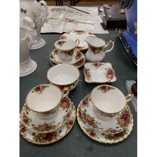 114 - A ROYAL ALBERT 'OLD COUNTRY ROSES' PART TEA SET TO INCLUDE CUPS, SAUCERS, PLATES, A CREAM JUG, SUGAR... 