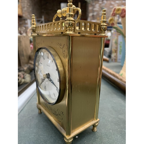 132 - A BRASS MANTLE CLOCK HEIGHT 15CM