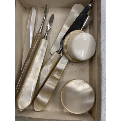 148 - A MOTHER OF PEARL MANICURE SET