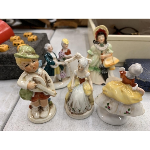 150 - A COLLECTION OF MINIATURE CERAMIC FIGURES