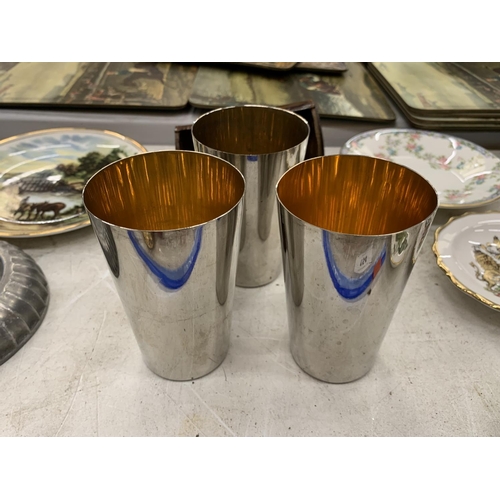 154A - A SET OF SILVER PLATED TUMBLERS IN A LEATHER CASE PLUS A SET OF SHOT CUPS IN A LEATHER CASE