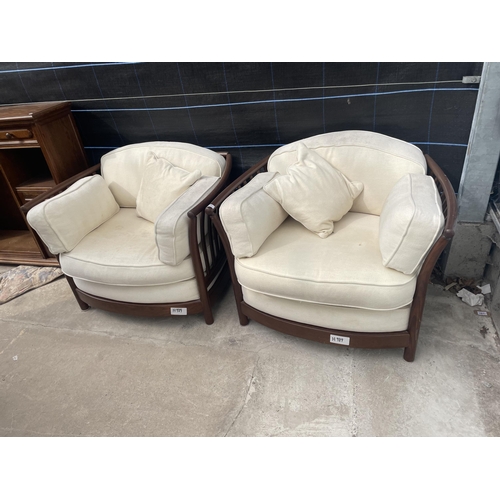 A PAIR OF ERCOL LOW BACK RENAISSANCE EASY CHAIRS