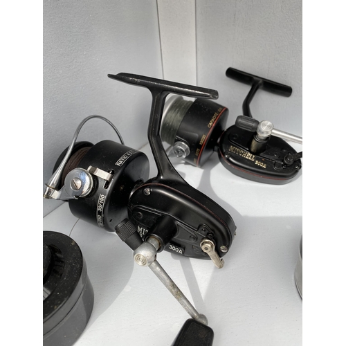 1739 - THREE MITCHELL FIXED SPOOL FISHING REELS CONSISTING OF TWO 300A WITH SPARE SPOOLS AND A 308 PRINCE I... 