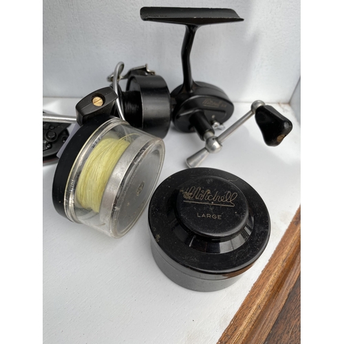 1739 - THREE MITCHELL FIXED SPOOL FISHING REELS CONSISTING OF TWO 300A WITH SPARE SPOOLS AND A 308 PRINCE I... 