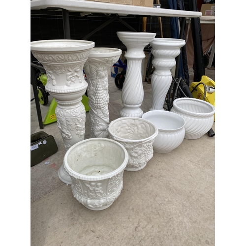 1753 - FOUR VARIOUS WHITE CERAMIC JARDINAIRE STANDS AND PLANT POTS