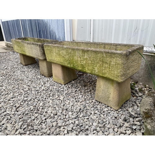 1959 - A PAIR OF RECONSTITUTED STONE TROUGH PLANTERS WITH PEDESTAL BASES