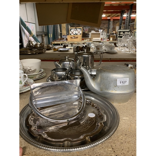 1127 - A STAINLESS STEEL TEASET ON A TRAY, A PICQUOT WARE TEAPOT, ETC