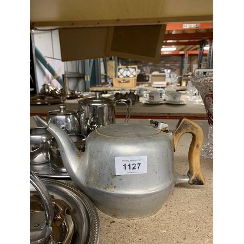 1127 - A STAINLESS STEEL TEASET ON A TRAY, A PICQUOT WARE TEAPOT, ETC