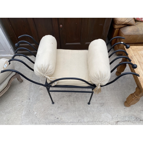 2987 - A BLACK CAST METAL STOOL WITH ROLLED ARMS AND TWO END CUSHIONS