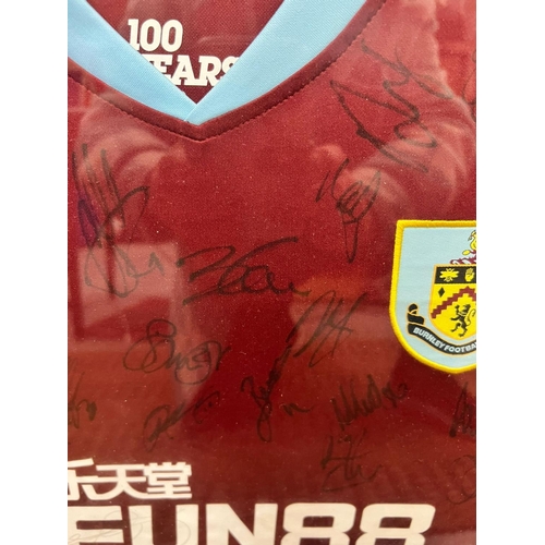 100 - A FRAMED BURNLEY FOOTBALL SHIRT SIGNED BY PLAYERS