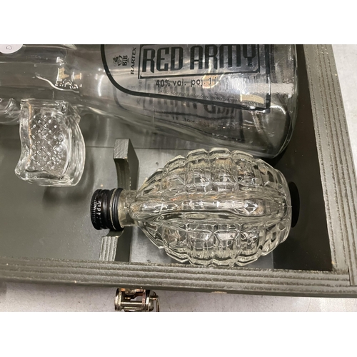 50 - A BOXED RED ARMY GLASS GUN SPIRITS BOTTLE, SIX GLASSES AND GRENADE HIP FLASK