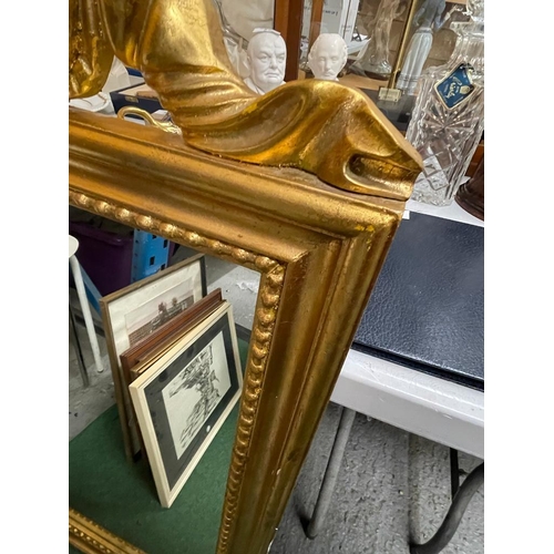 62 - AN ORNATE GILT FRAMED MIRROR WITH RIBBON DESIGN TOP