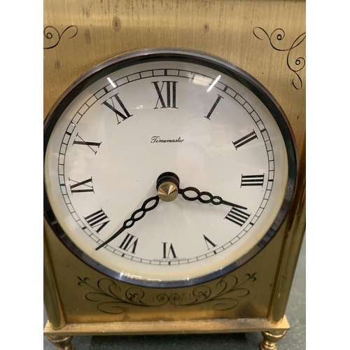 132 - A BRASS CARRIAGE CLOCK HEIGHT 15 CM