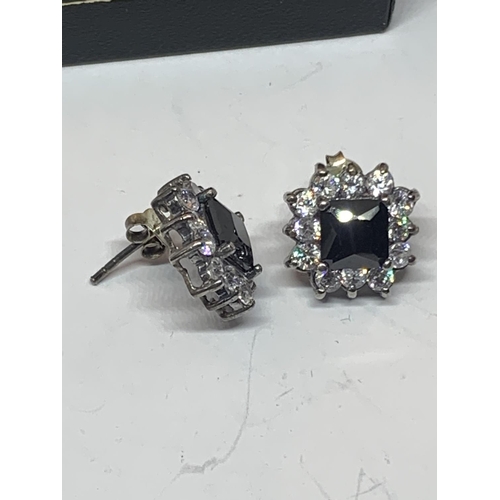 535 - A PAIR OF SILVER EARRINGS WITH A DARK STONE SURROUNDED BY TWELVE CLEAR STONES IN A PRESENTATION BOX