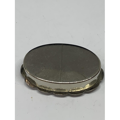 611 - A POSSIBLY SILVER OVAL PILL BOX WITH MOTHER OF PEARL