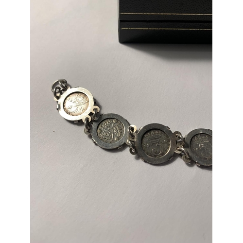 630 - A SILVER JOEY THREE PENCE PIECE BRACELET WITH A PRESENTATION BOX